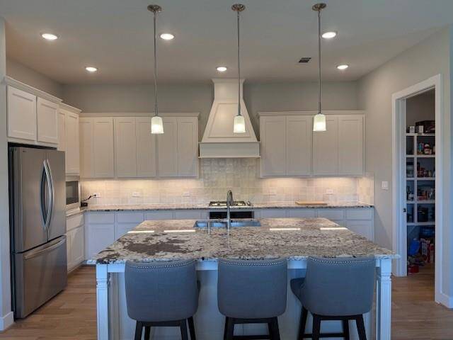 Well appointed kitchen with Walk In Pantry, Gas Cook Top and beautiful stainless steel appliances.