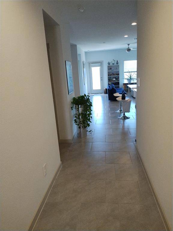 View looking from front door into living area.
