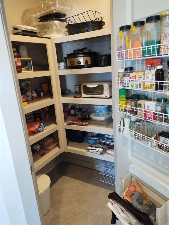 Large walk in pantry.  Spice rack excluded.
