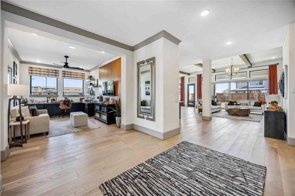 Just off the main entry, a dedicated study with custom built-ins and designer finishes provides the ideal work-from-home space.