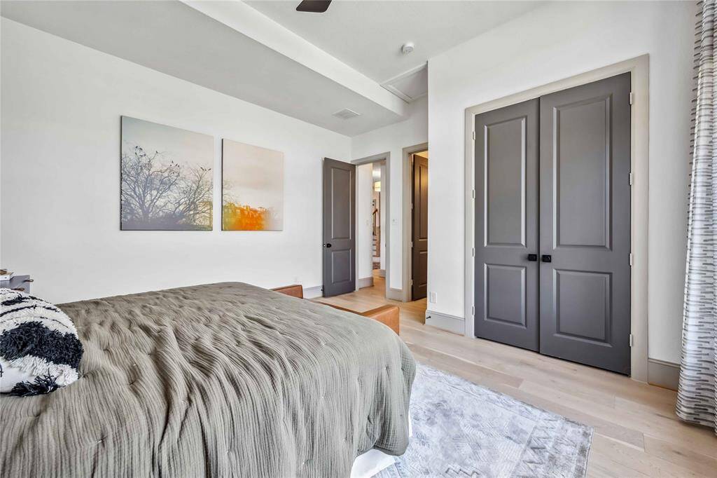 The room includes a large closet with double doors and a neutral palette, perfect for guests or multi-generational living.