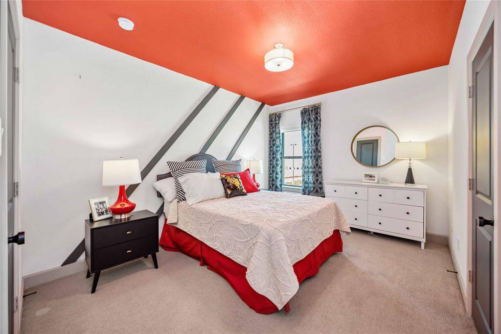 Upstairs bedroom offers generous space and natural light, perfect for guests or family members.