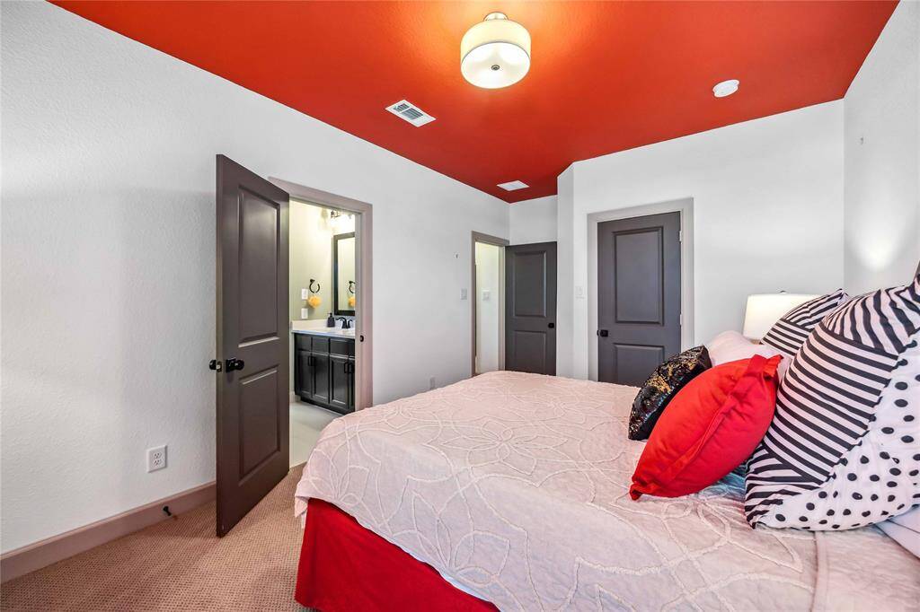 This spacious secondary bedroom offers private access to a shared Jack and Jill bathroom, perfect for families or guests.