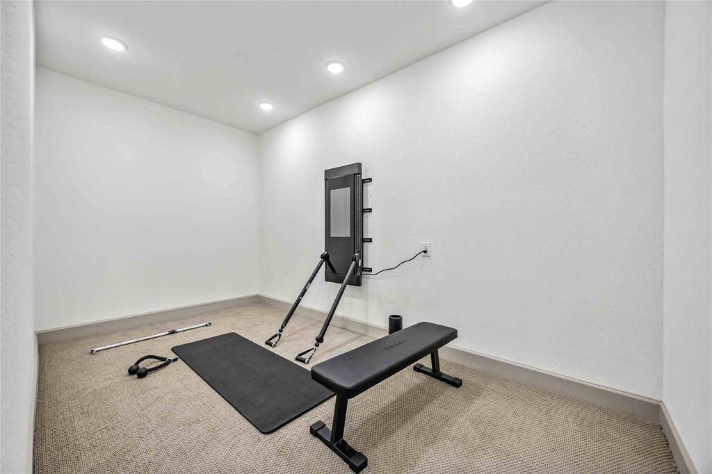 This flexible space on the second floor, located just off the media room, is ideal for a home gym, hobby room, or additional bedroom.