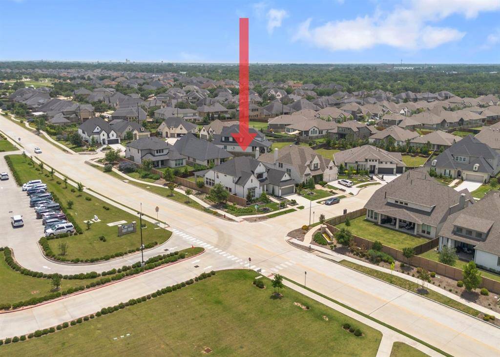 Positioned on a prominent corner lot, this home stands out in the neighborhood with its spacious yard, prime location, & close proximity to community amenities, schools, & scenic walking trails.