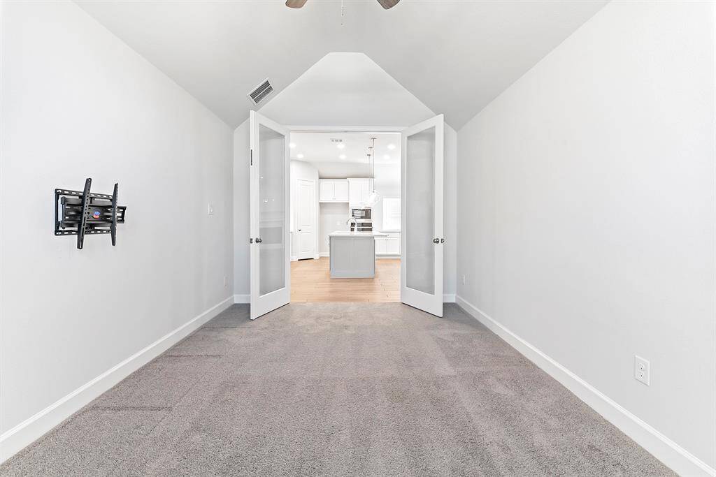 Another view showcases the spacious layout, offering plenty of room for a game room, home office, or even extra seating—perfect for flexible living.