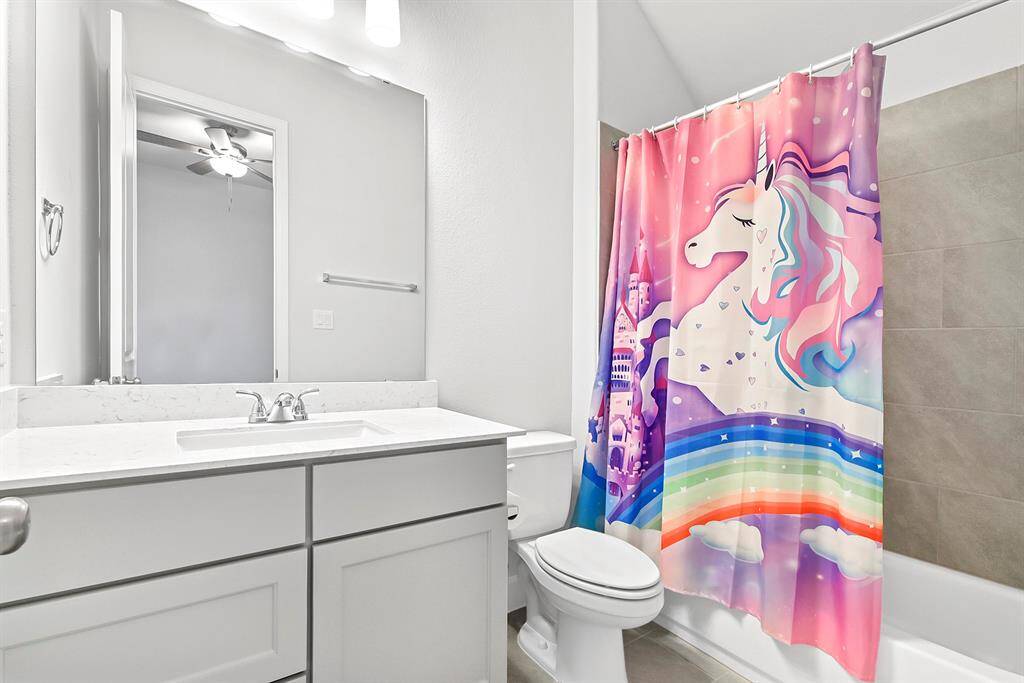 The full bathroom attached to the junior ensuite features a convenient tub-shower combo.