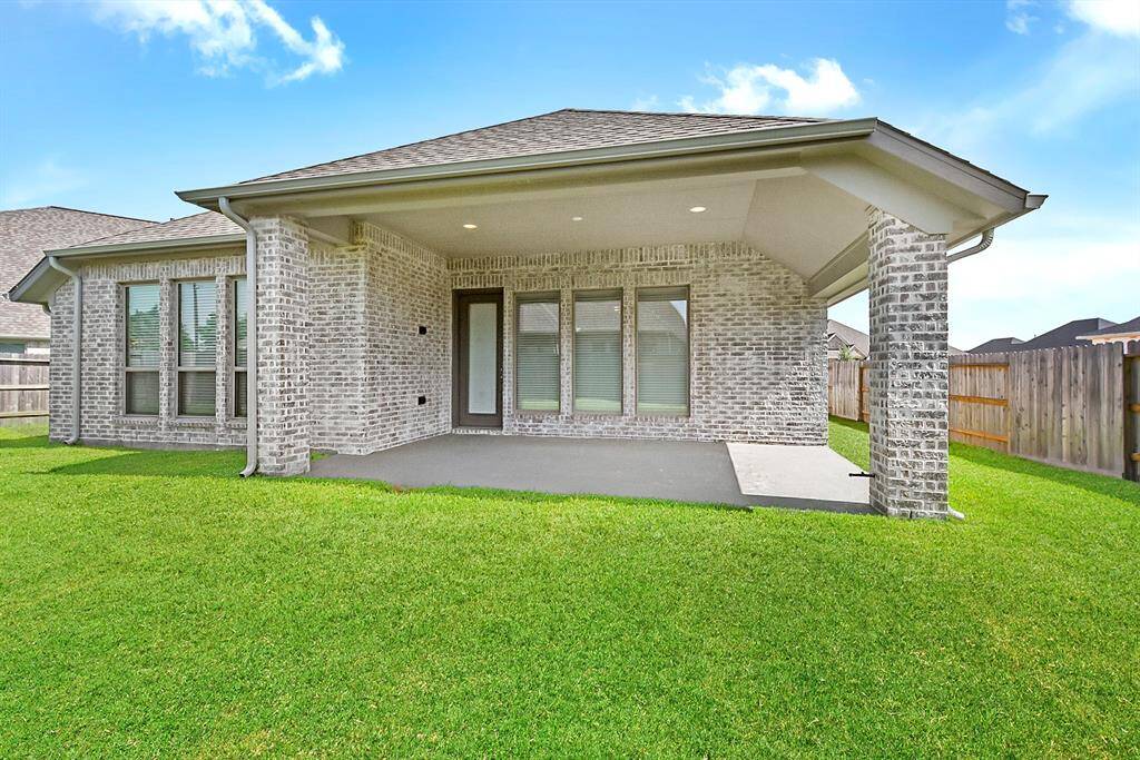 Another view showcases the generous size and space of this outdoor covered patio, perfect for entertaining or relaxing.