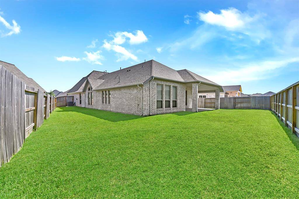The backyard has a pie-shaped layout, providing extra space and added separation between neighboring homes—perfect for privacy and outdoor enjoyment.