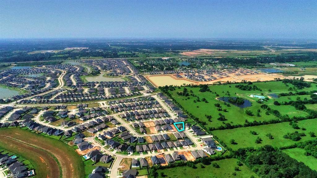 Another view from further out offers a broader perspective of the property, showcasing its location within the neighborhood and the surrounding area.