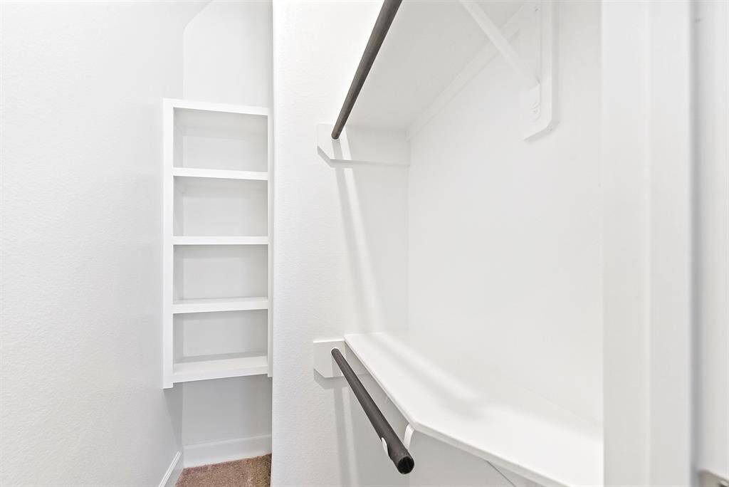 Each room includes extra closet space with built-in shelving and hanging rods, providing ample storage and thoughtful organization for wardrobes and more.