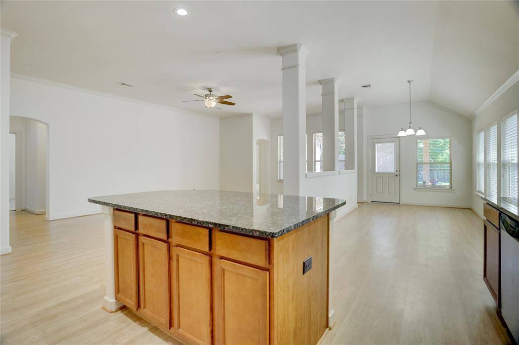 Lofty ceilings and numerous windows make this room glow with warm natural light.