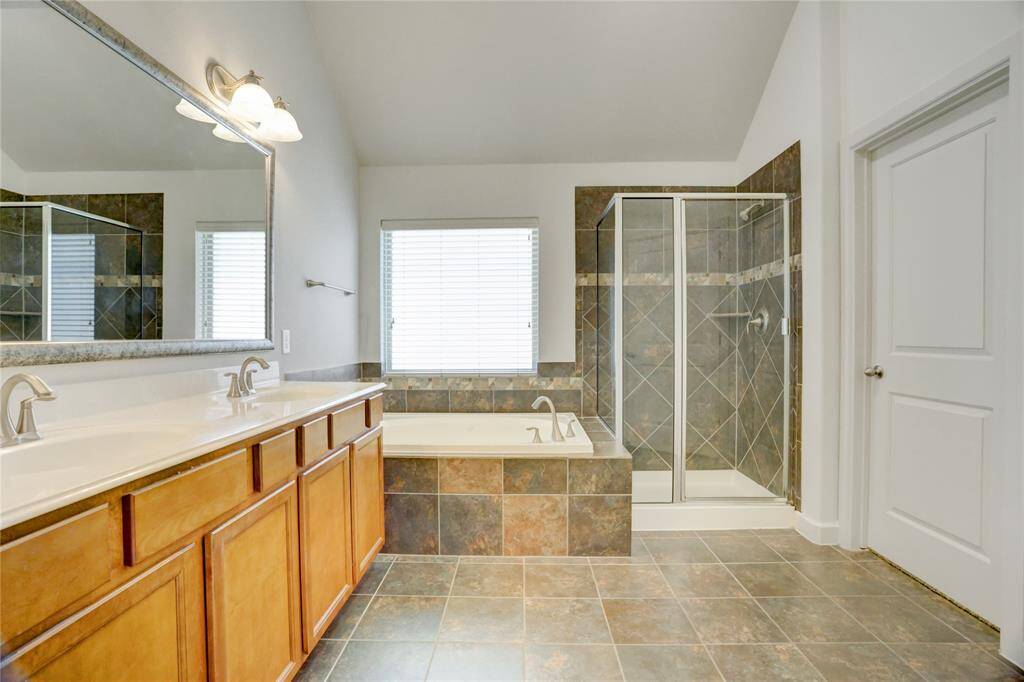 Double sinks, jetted tub, and oversized shower ticks all the boxes.