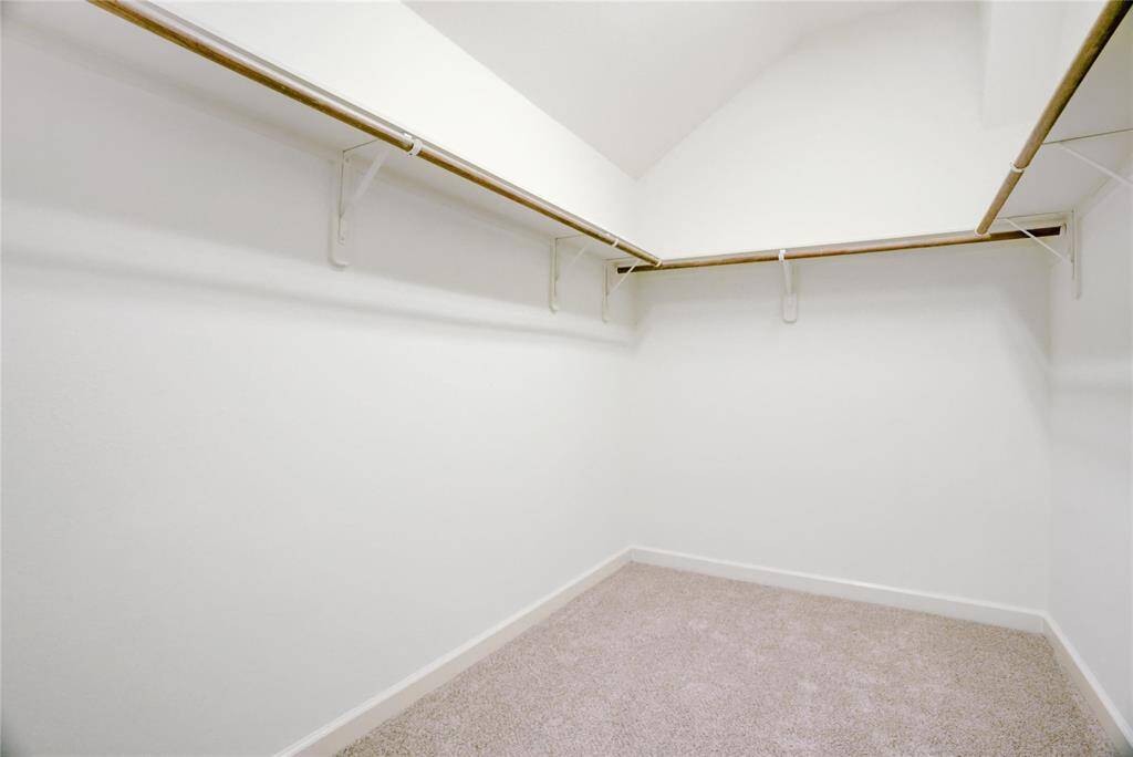Large primary closet is large enough for all your favorite things.