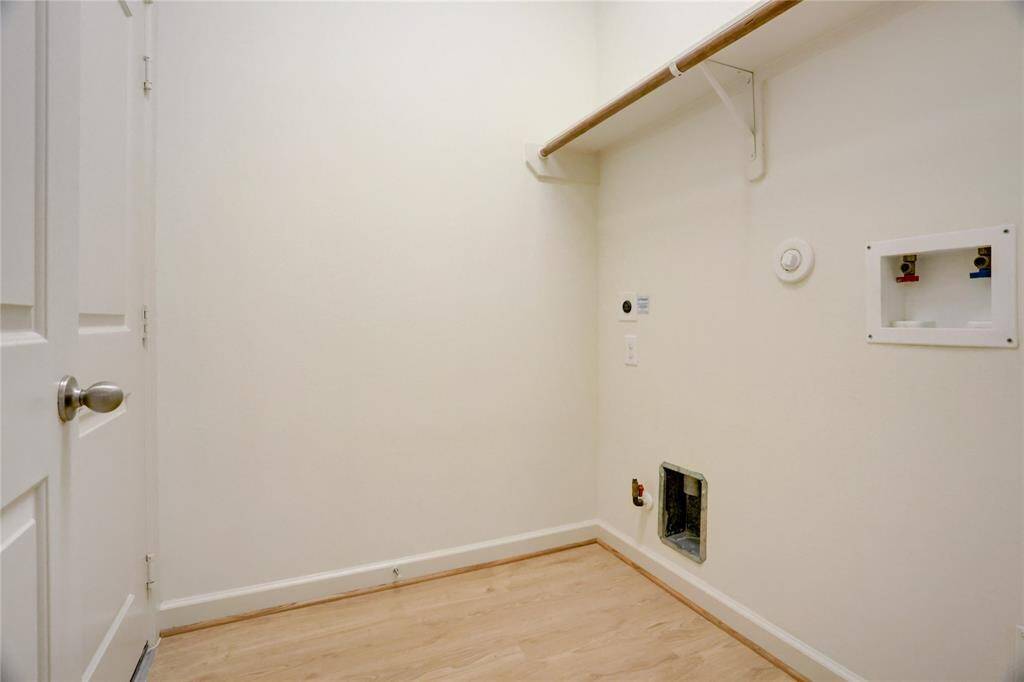 Laundry room has electric and gas hook ups for your dryer of choice and storage too!