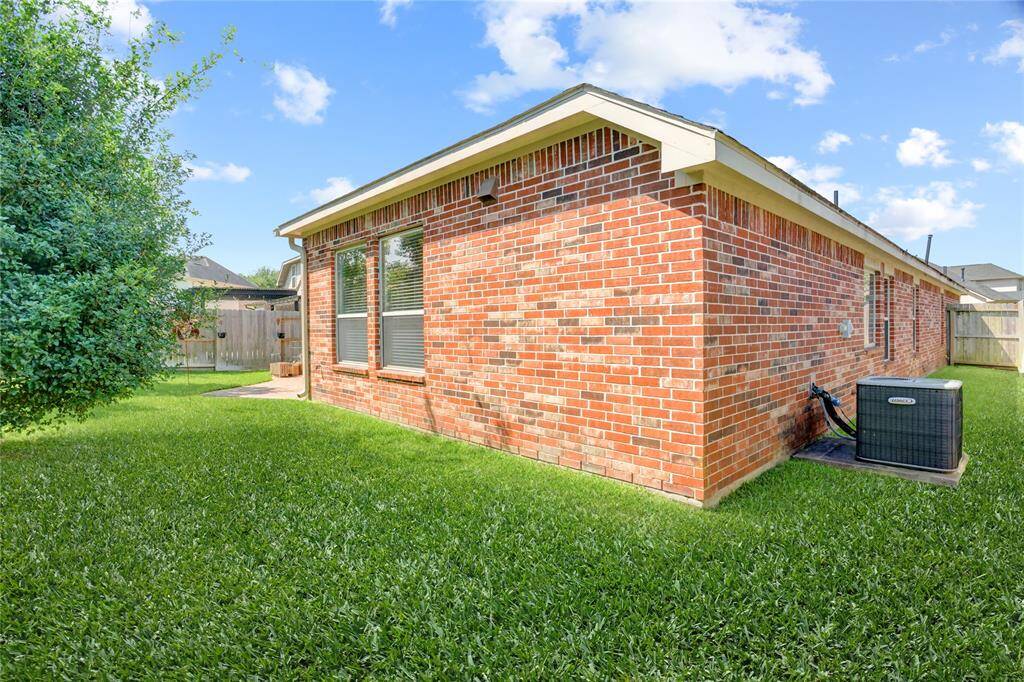 Quality construction of this David Weekley home includes easy maintenance brick on all 4 sides.