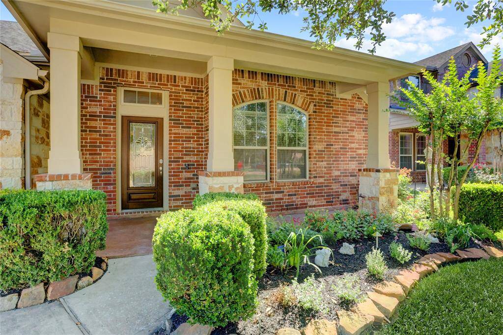 The charming front porch greets your guests and conceals deliveries.