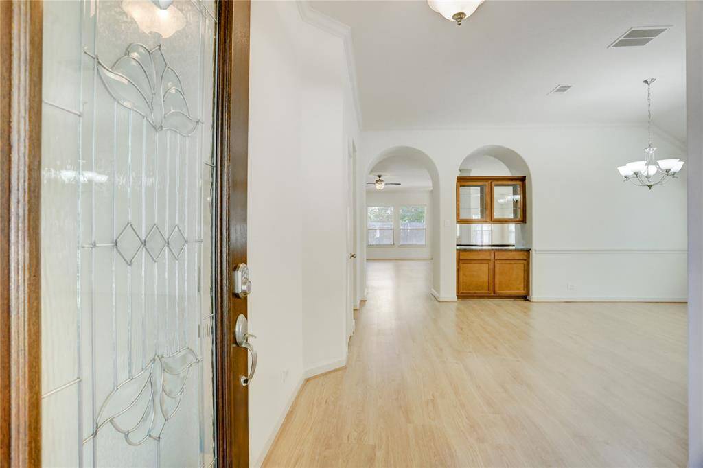 Entry is light and bright with fresh paint and new engineered wood flooring.