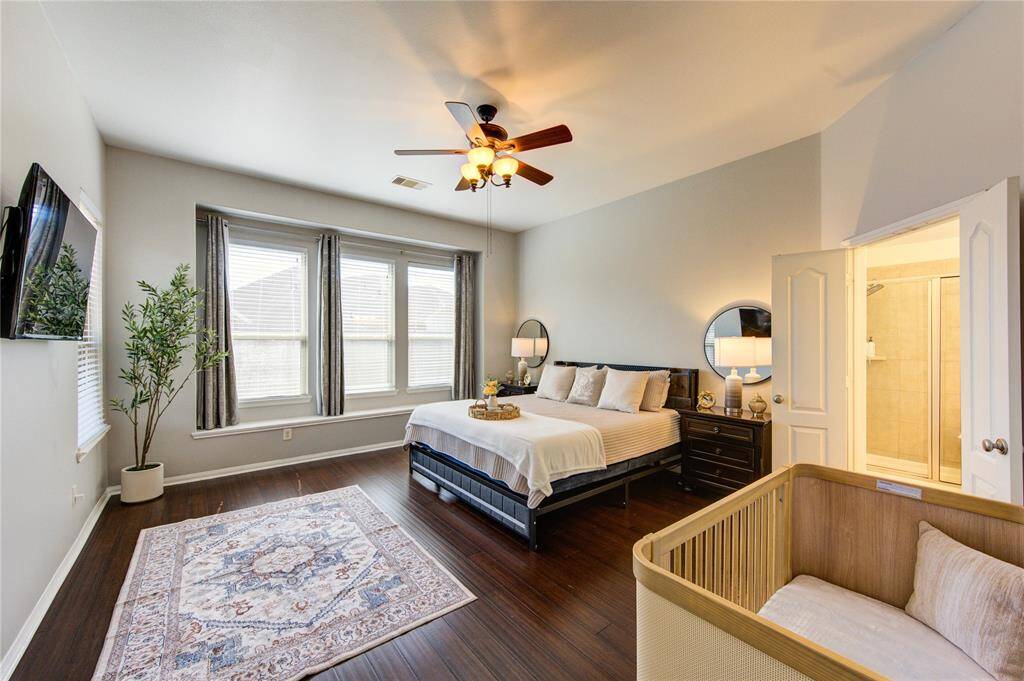 The spacious primary room is a peaceful retreat, offering comfort and privacy with plenty of natural light and room to unwind. Designed with relaxation in mind, it features ample space for a king-sized bed and cozy sitting area, making it the perfect place to recharge