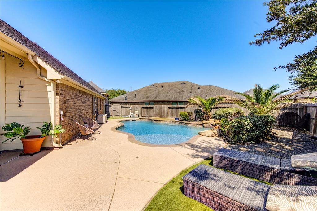 Step into your own private resort!! Whether you are lounging in the sun, hosting a summer pool party, or enjoying a peaceful evening swim, this backyard delivers year- round luxury.