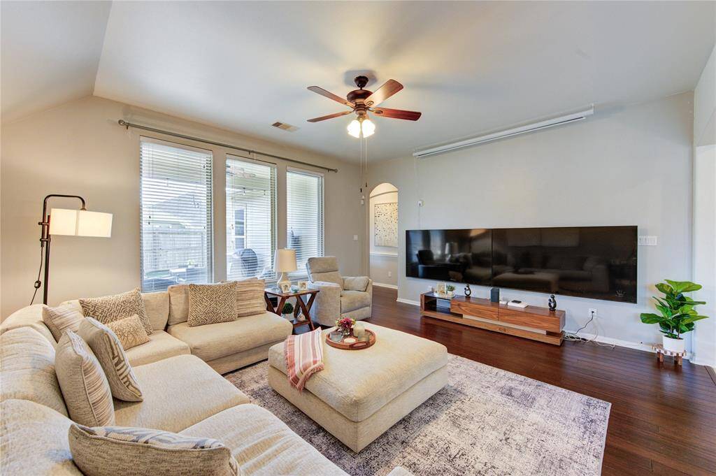 The living room offers a comfortable and inviting space to relax or gather with family and friends. With ample natural light, cozy ambiance, and room to personalize, it's the heart of the home for everyday moments and special occasions alike.