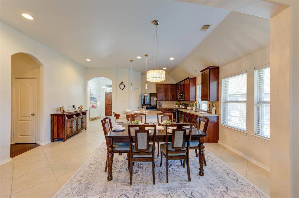 The dining room provides a warm and welcoming setting for both casual meals and special gatherings. With plenty of space for a large table and easy flow to the kitchen and living areas, it’s perfect for hosting and everyday dining alike