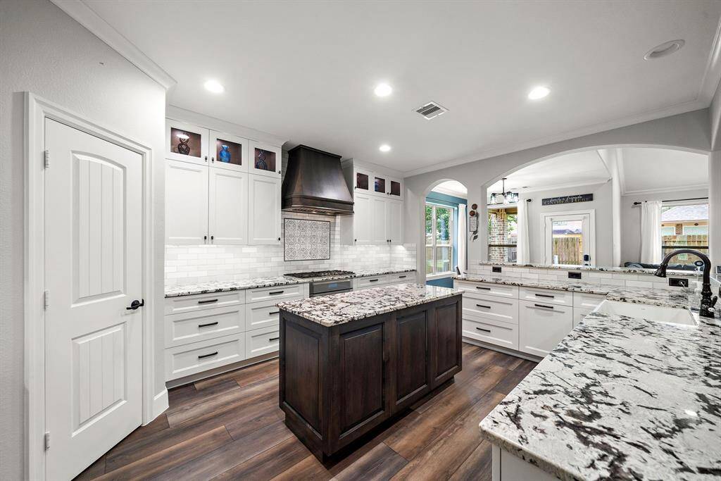 Custom pantry with heavy-duty shelving and bonus storage space and added shelving.