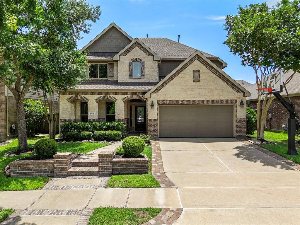 Meticulously maintained home features a generous sized front porch and an extended driveway that adds 3 feet of width and connects walk way to the front porch with custom pavers.