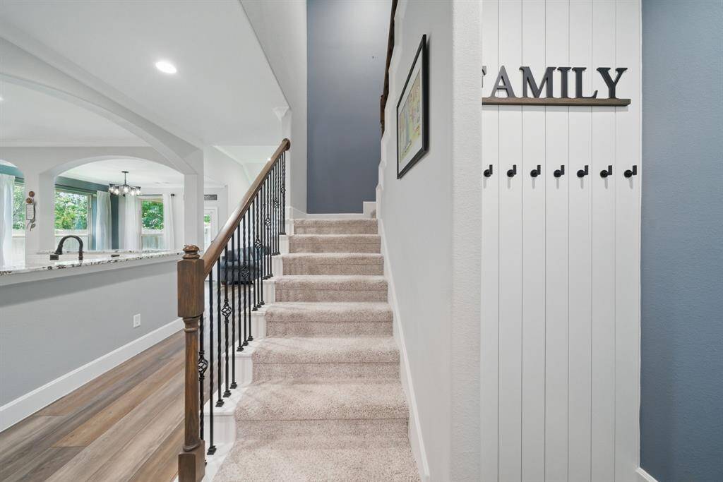 Hidden closet under the staircase has a custom-made hidden door that is virtually indetectable.