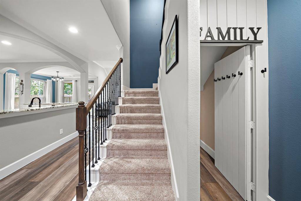 Hidden closet under the staircase has a custom-made hidden door that is virtually indetectable.