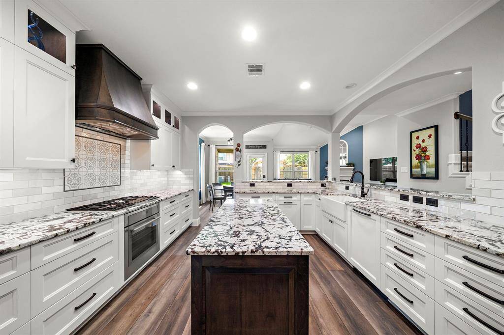 Welcome to your custom chef's dream kitchen! Top of the line luxury flush Thermador appliances. Top-level Sensa 3cm granite countertops, sleek subway tile backsplash and Premium Blum German soft-close hardware throughout.