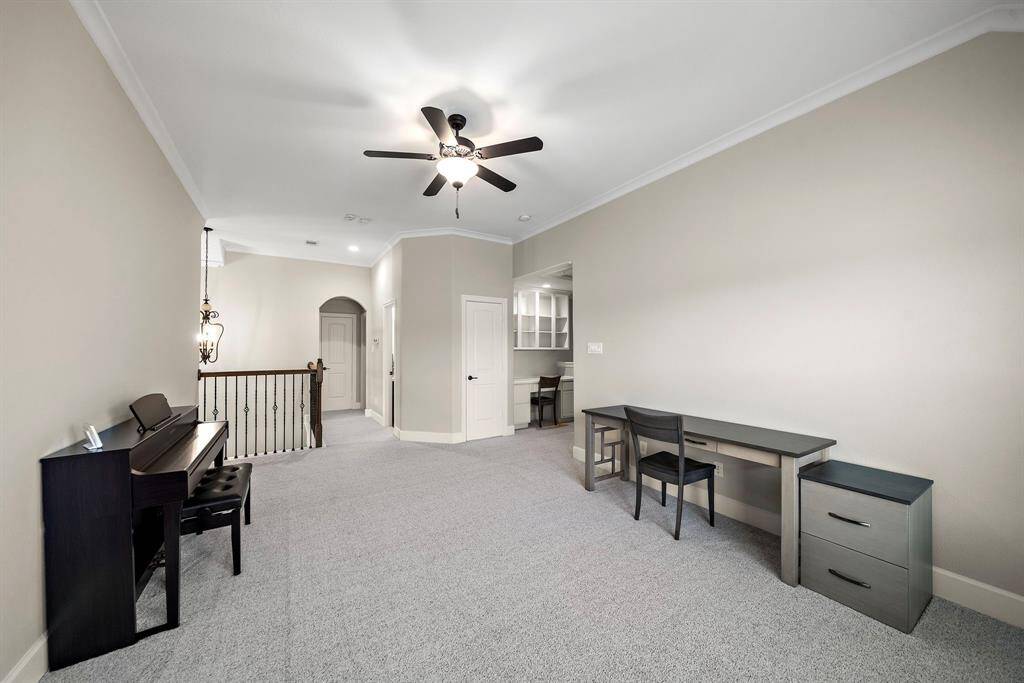 Expansive game room for movie nights or play space.