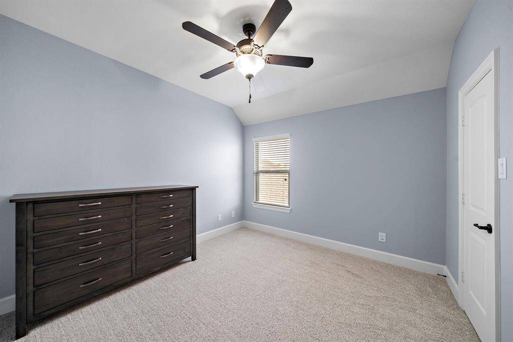 Three additional bedrooms, each with luxury Anderson carpet, blinds, and ceiling fans.