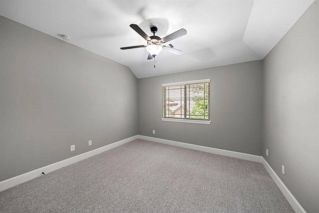 Three additional bedrooms, each with luxury Anderson carpet, blinds, and ceiling fans.
