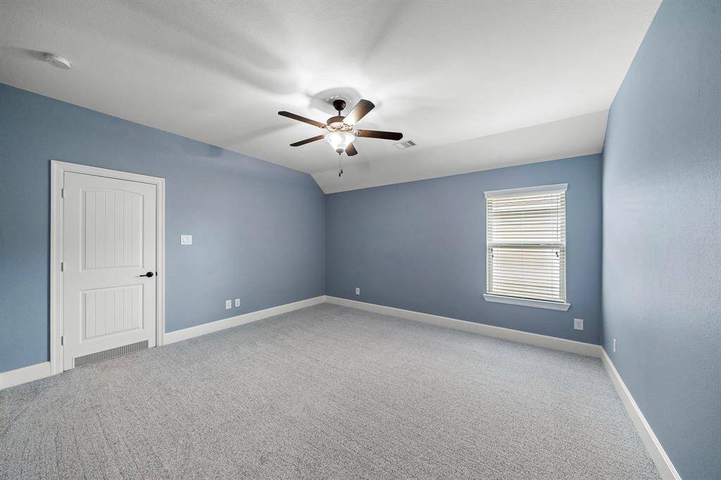 Three additional bedrooms, each with luxury Anderson carpet, blinds, and ceiling fans.