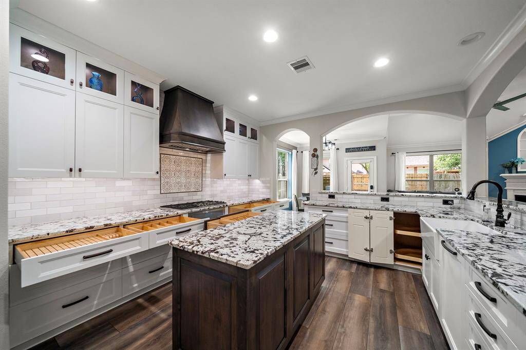 Fully custom built kitchen with frameless solid wood cabinetry and built-in smart lighting. A place for every kitchen utensil, pot and pan! Individual custom drawers and cabinets including large lazy susan corner cabinet.