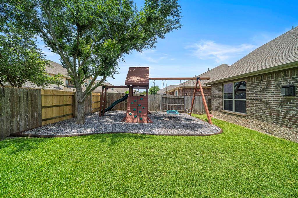 Custom build solid wood play set with Jellybean non toxic mulch.
