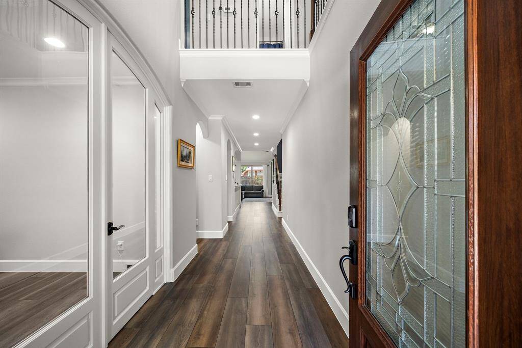 Elegant top of the line COREtec LVP throughout the main areas of first floor. New solid hardwood custom trim, tall baseboards, casing and crown molding throughout home.