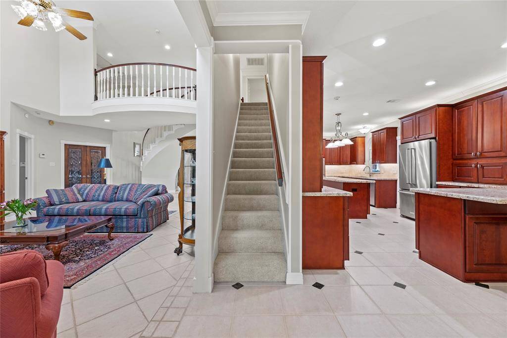 A second staircase, conveniently located near the family room and kitchen, offers easy access to the upper level—for seamless everyday living.