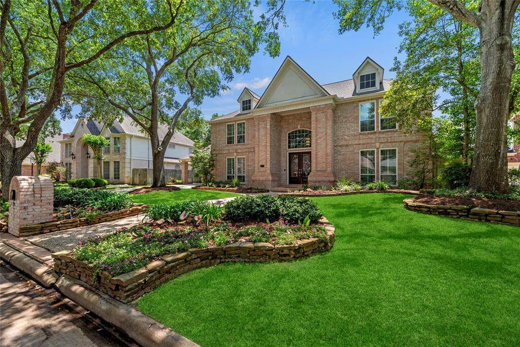 Alternate view of the front of the home featuring the beautiful front yard.