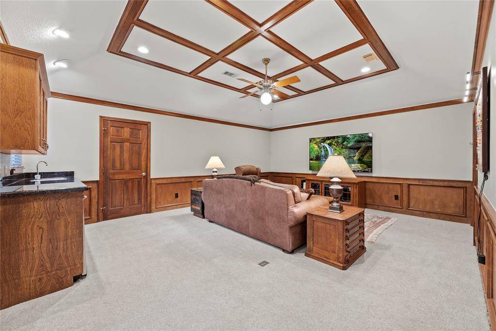 The flex room / game room / media room on the second floor has endless possibilities.  Having potential to be a versatile living space, ideal for entertainment or a movie room. With plenty of room only the imagination is limiting you for the endless uses of this massive space.  Measuring 19.9x15.3 you could easily accomodate  gaming tables, video game, 3 d printers or any other hobbists needs.  The room also has a closet for storage and a wet bar.