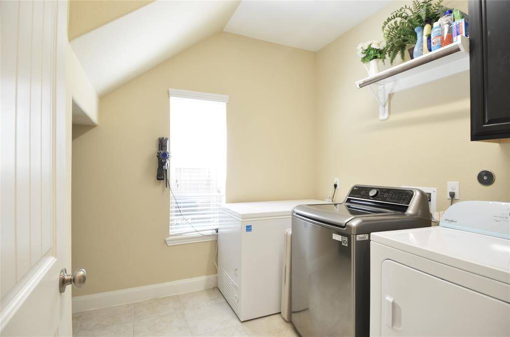 Large laundry with under stairs storage to the left here.