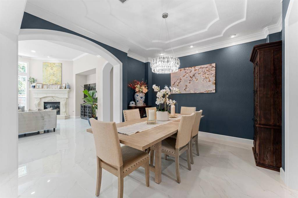 Beautiful dining room with new chandelier and art lighting.