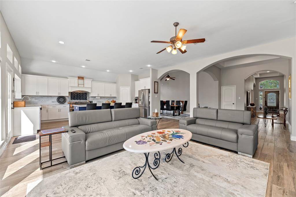 A wonderful shot of the openness that this home offers. You will never be tucked away in a secluded kitchen while your family enjoys each other!