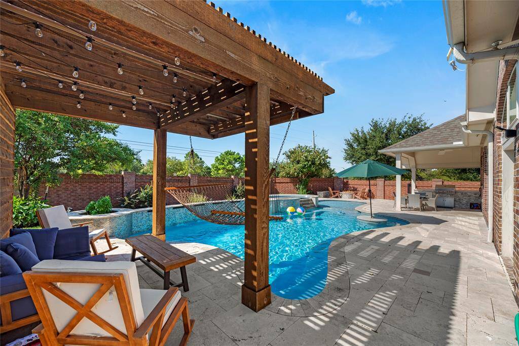 The pergola features a waterfall system (not shown) that adds charm, fun and aesthetics to the backyard.