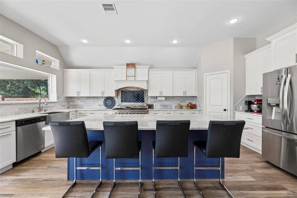 Another look at the great kitchen. We will head through the living room to the secluded primary bedroom.