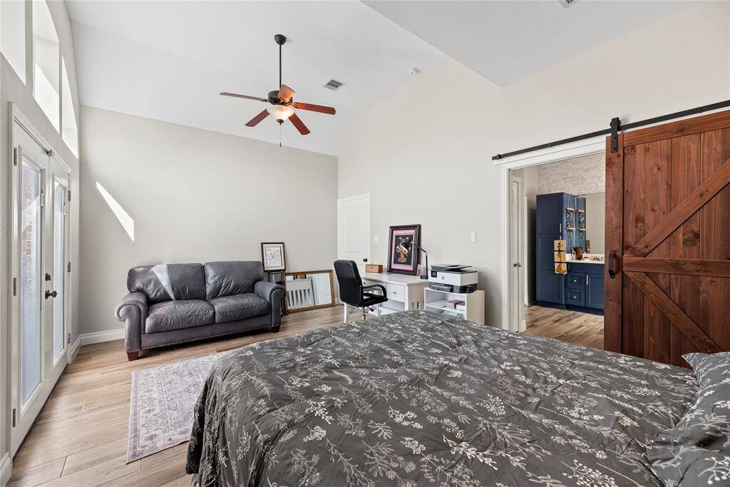 The oversized primary has space for a large bed, desk and seating area without feeling crowded.