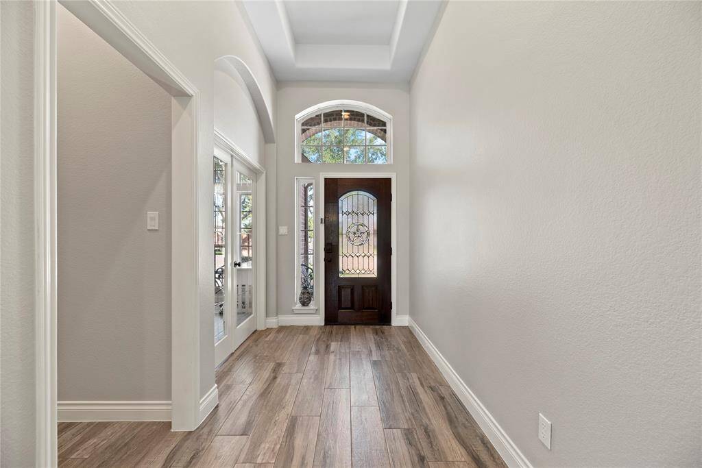 Heading back towards the front of the house, the hallway on the left here take us some secondary bedrooms and their full bath.