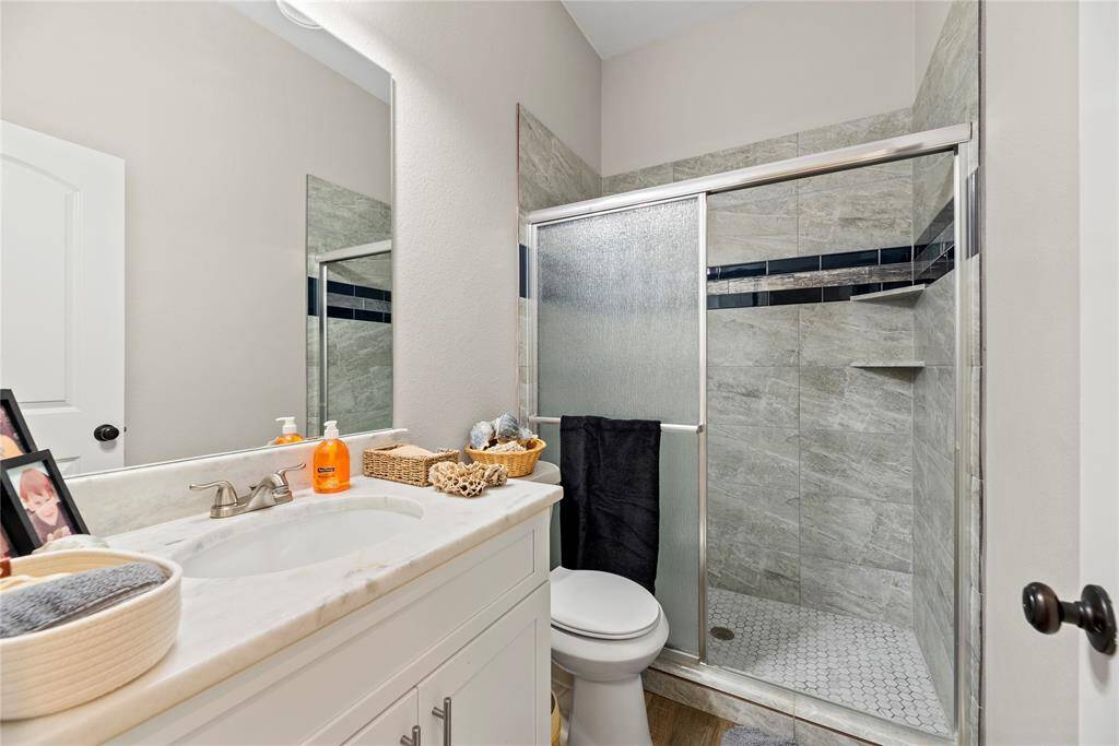 A well appointed and upgraded full bath service bothe of these bedrooms.