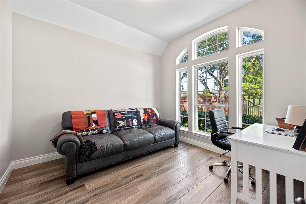 High ceilings and elegant windows make this office feel bright and welcoming.